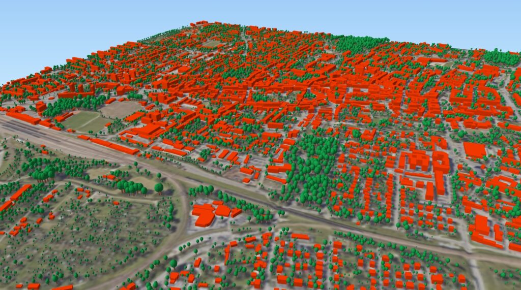 zrzut ekranu przedstawiający wygenerowane modele 3D drzew wraz z modelami 3D budynków.